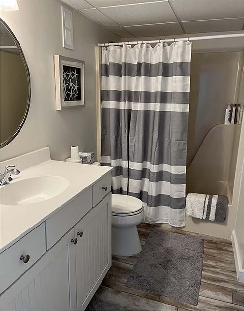 Second bedroom suite with twin basins and shower. 