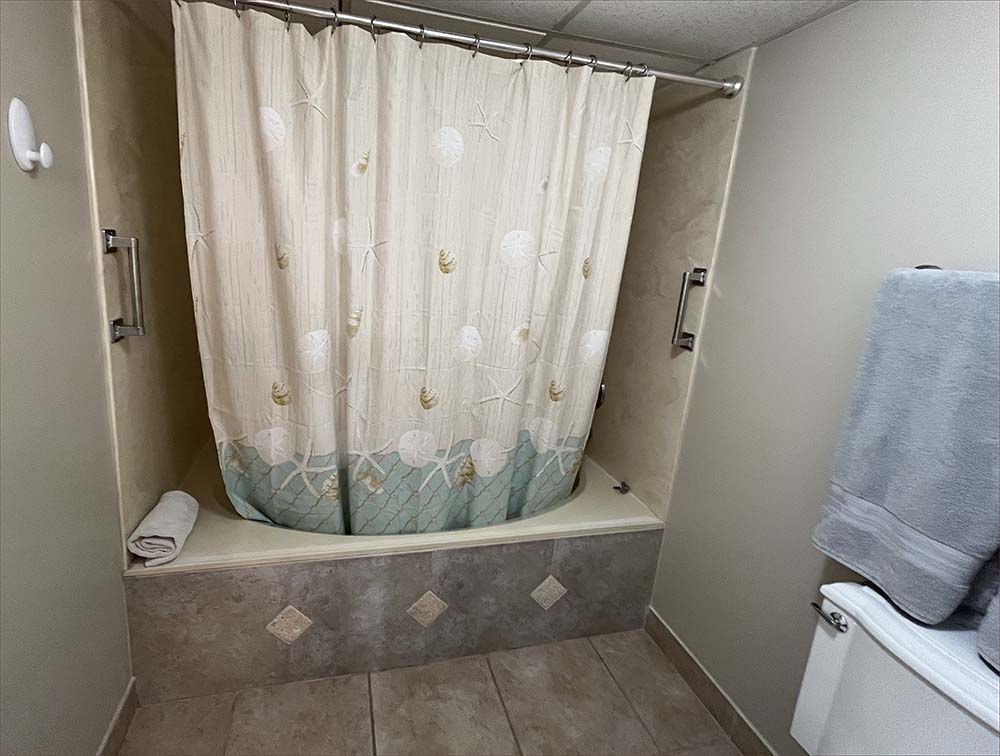 Master bedroom features an en-suite bathroom with twin sinks and countertops.