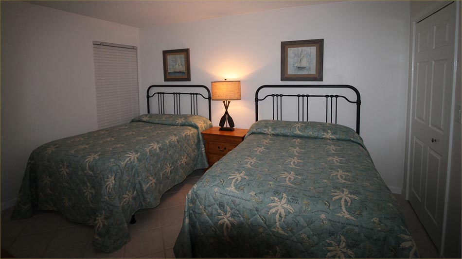 Two double beds and private bathroom.