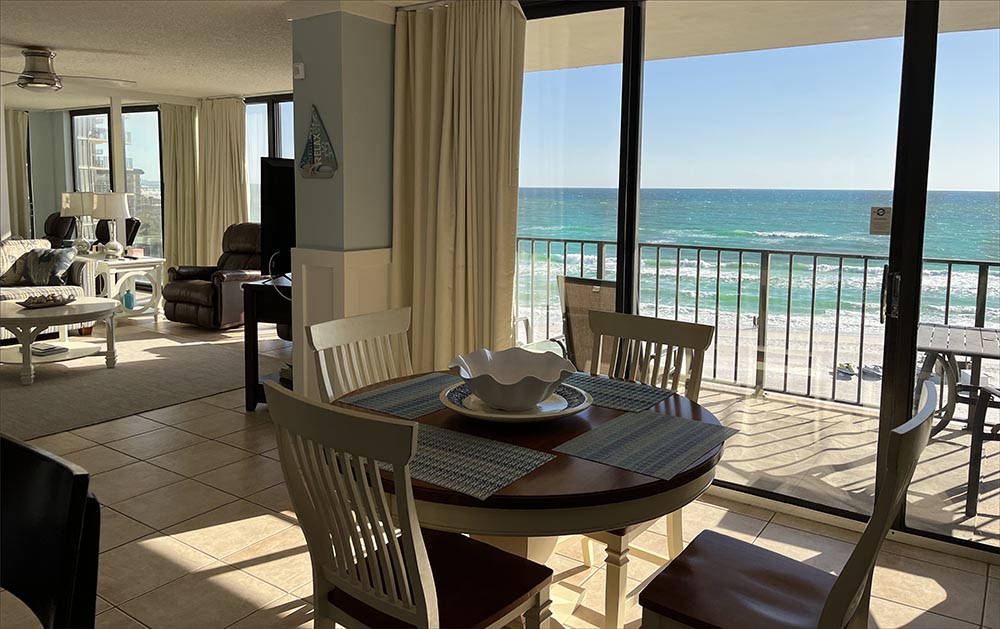 Full sized dining room with breathtaking views of the blue green Gulf of Mexico and sugar sand Panama City Beach.