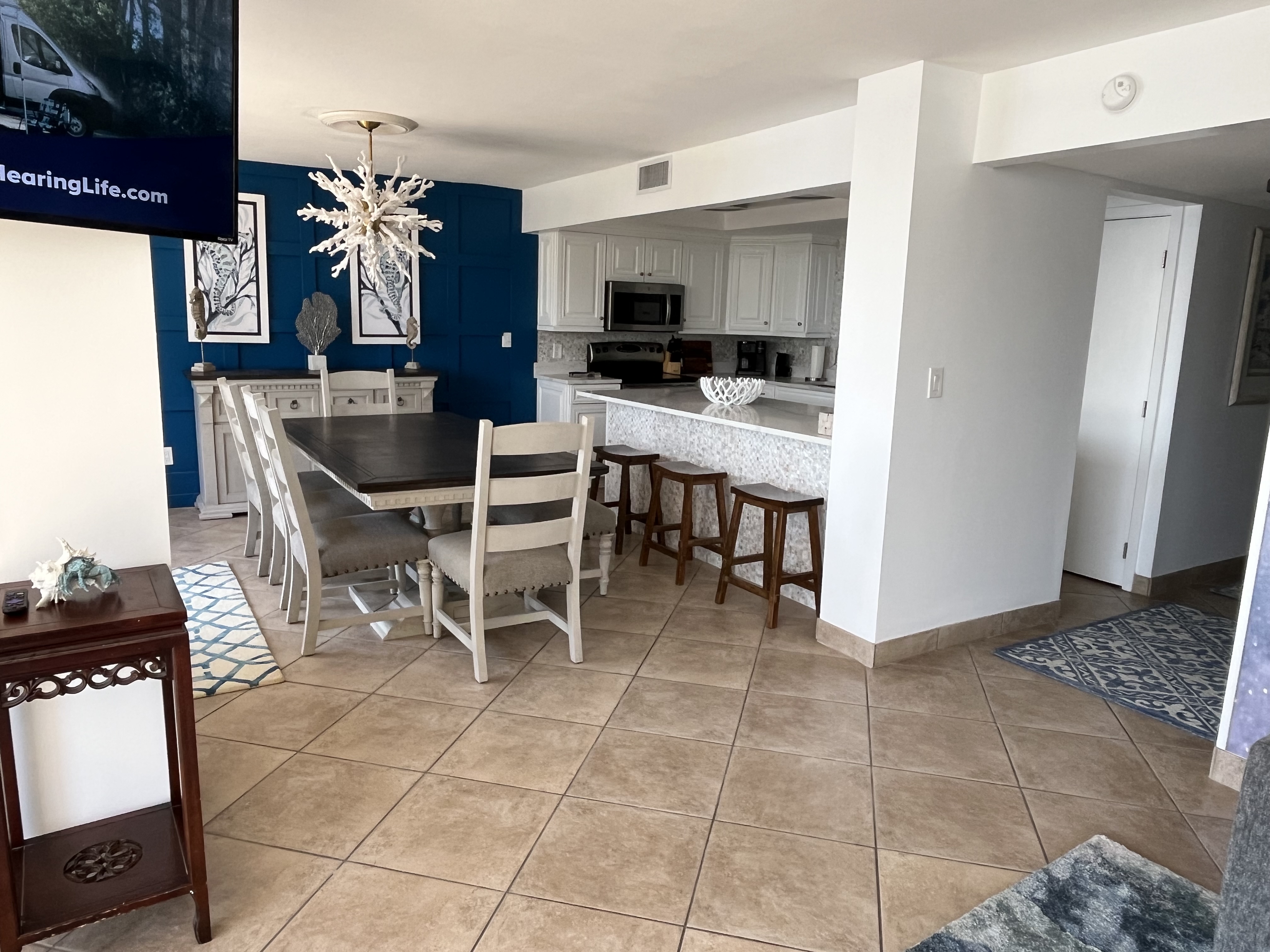 Beach condo includes a dining room with seating for 6.