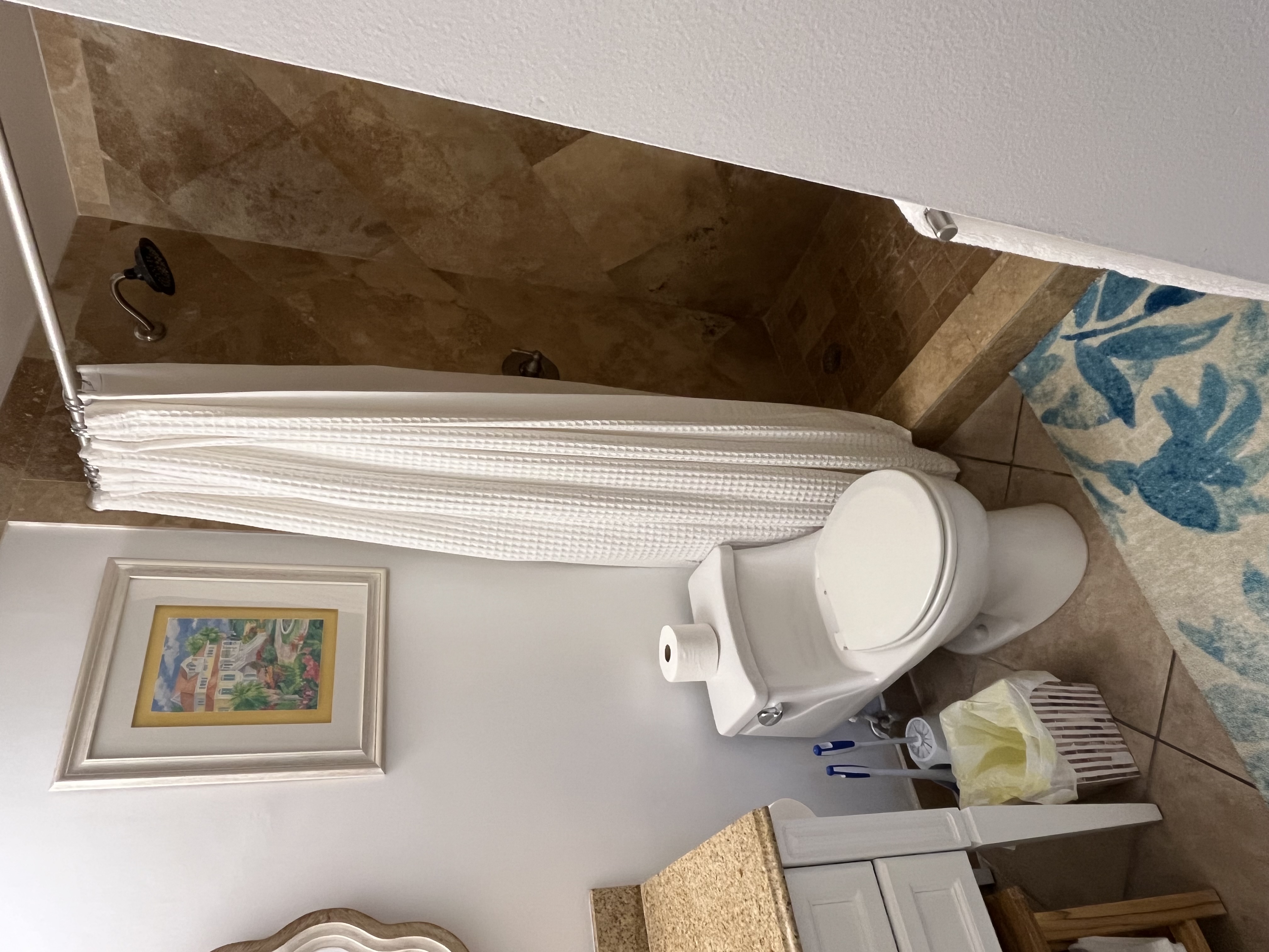 Guest bathroom attached to the hallway and 2nd guest room.