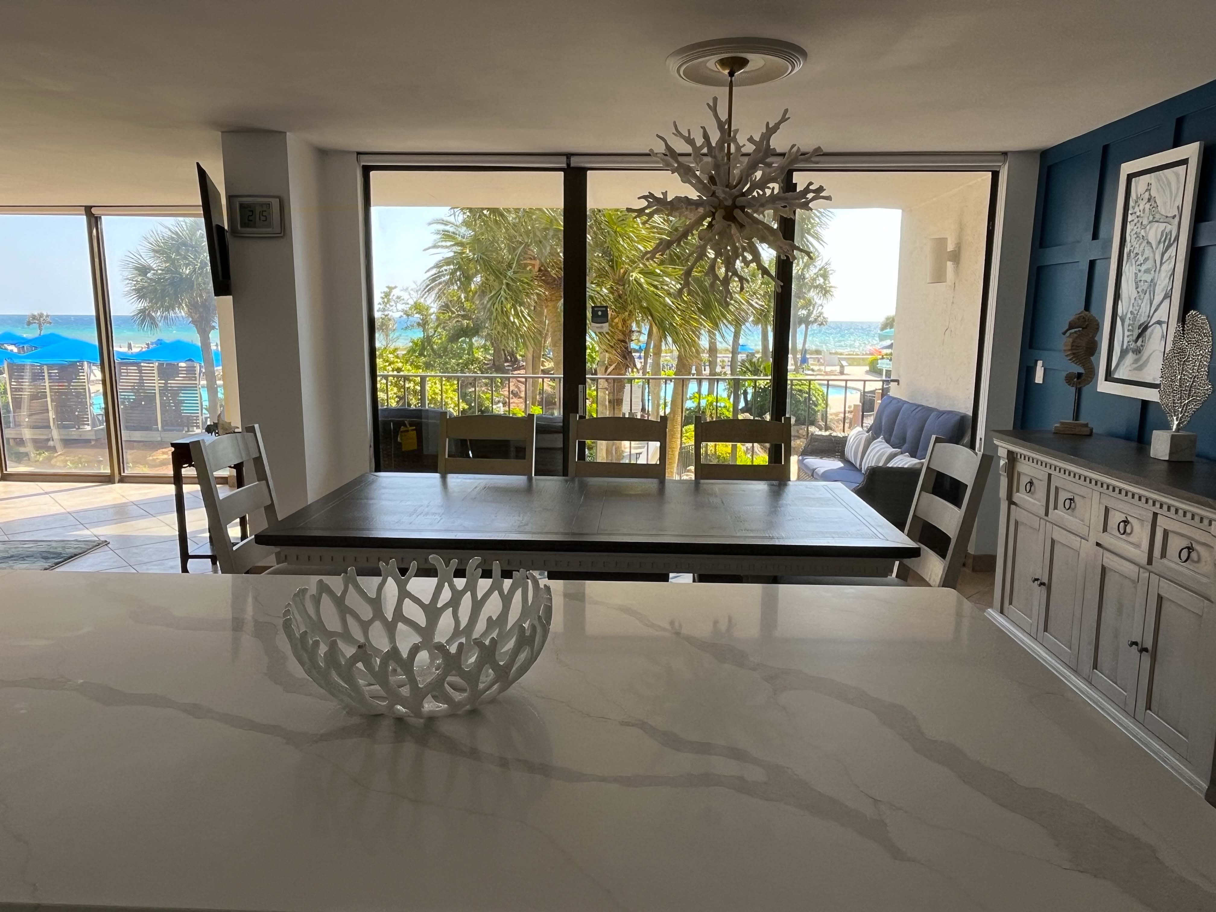 Beach condo includes a dining room with seating for 6.