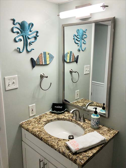 The 2nd bathroom features a large step in shower and vanity with decorator faucets.
