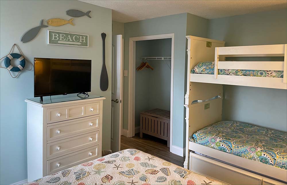 The 2nd bedroom includes a queen bed, and twin bunk bed.