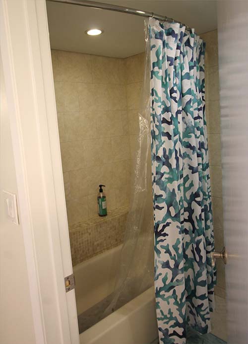 Master bathroom features a shower and tub.