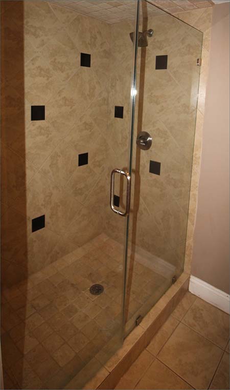 Walk in attached bathroom with shower and vaniety.