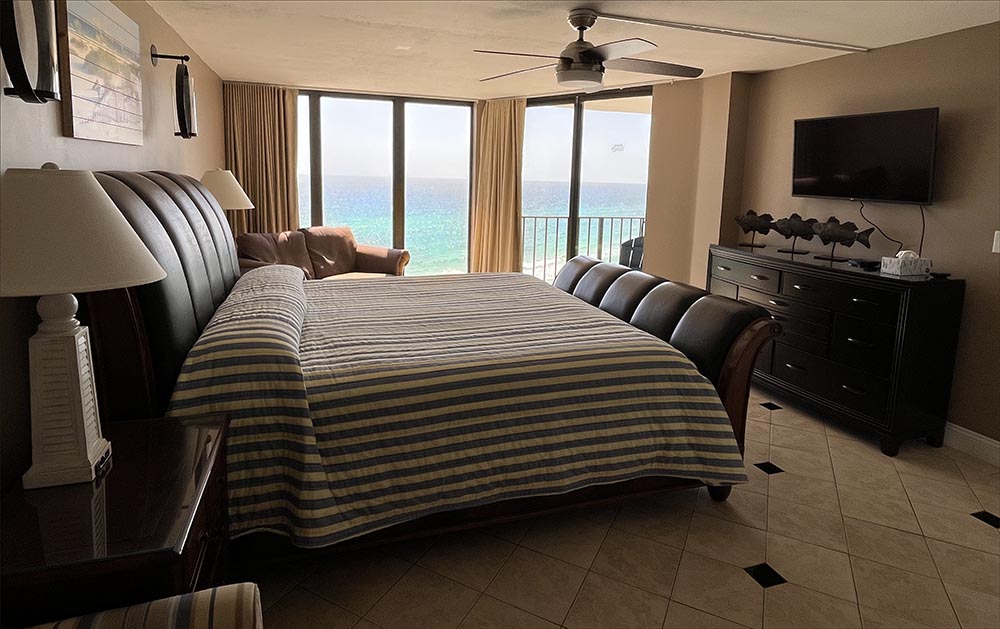 King sized master bedroom with love seat and astonishing views of the Gulf.