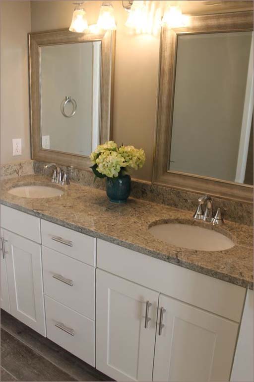 Master bathroom with twin vanities and lots of closet space.