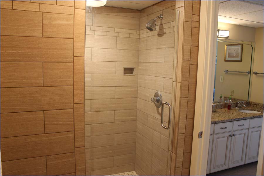Large master bathroom with twin vanities and shower and tub.