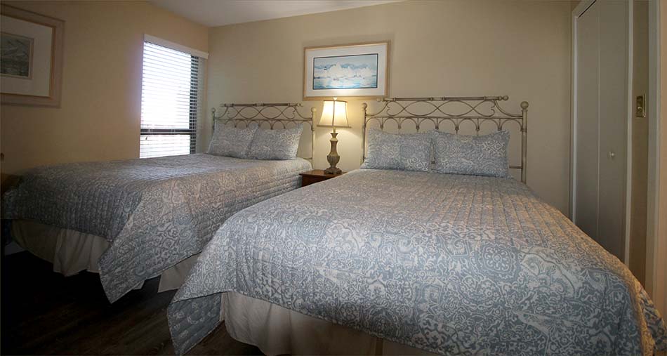 Two queen beds in the third bedroom with full attached bath.