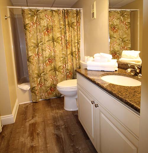 Third bathroom attached to the third guest room with two queen beds
