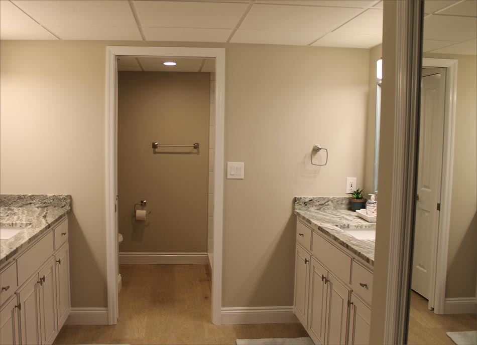 Main Master bath and closets includes twin vanities and shower.