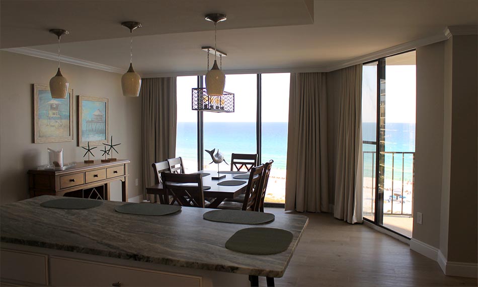 The kitchen, breakfast bar and dining area all look out onto the beach.
