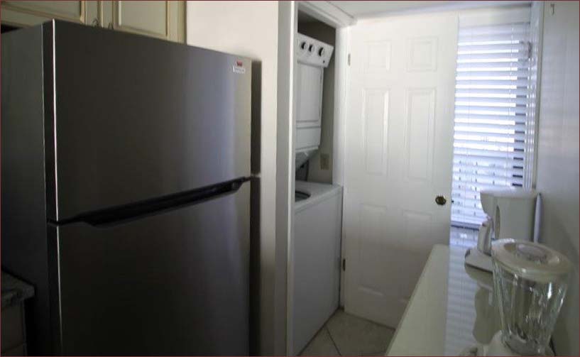 Private washer and dryer and stainless steel appliances.