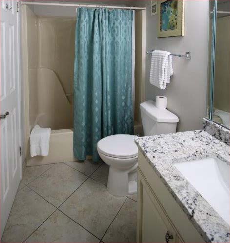 King sized master bedroom en-suite with shower, bath and new granite vanity.