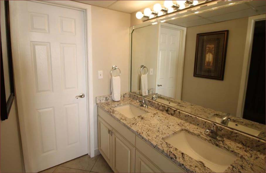 Master bathroom features new granite countertops a duel basin sink and large garden tub bath.