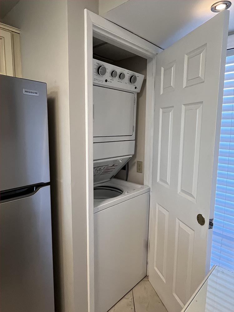 Private washer and dryer and stainless steel appliances.