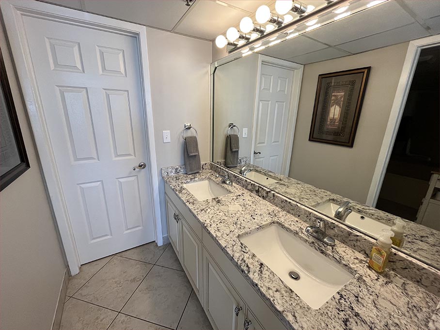Master bathroom features new granite countertops a duel basin sink and large garden tub bath.