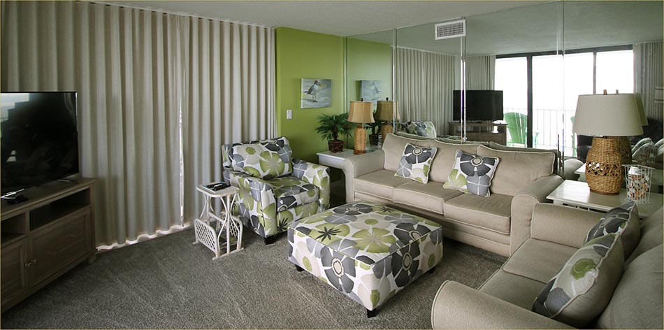 Comfortable, easy furnishings, cool tile floors and HDTV open to the large wrapping balcony and views.