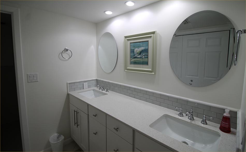 Guestroom includes a large private bathroom with bath and shower combo.