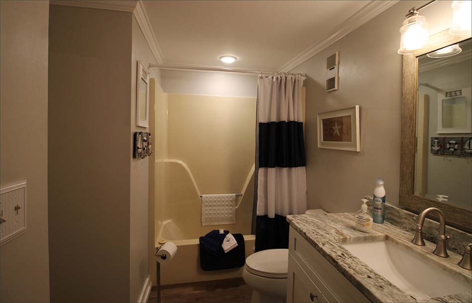 Full bathroom #3 with shower tub combo.