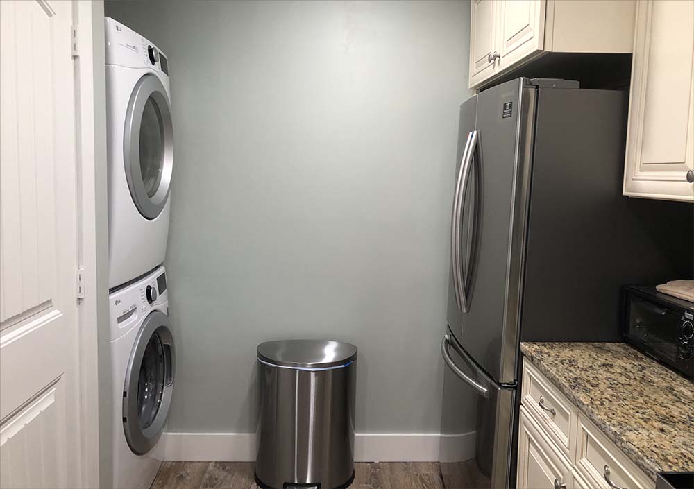 Full sized private washer and dryer.