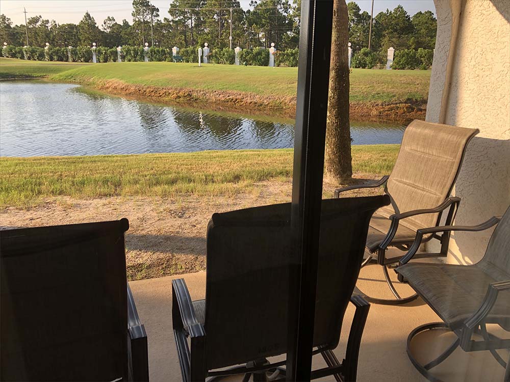 Ground Floor Edgewater Golf Villa features a private patio with seating.