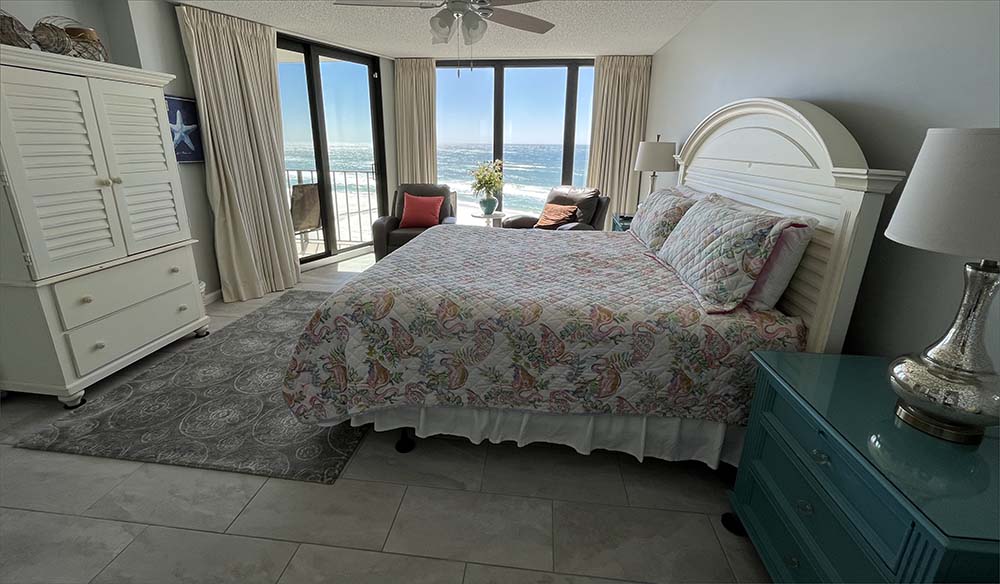 Breathtaking sunsets on the Emerald Coast master bedroom king bed.