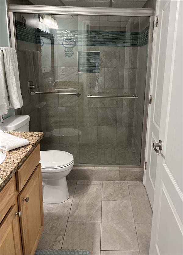 Large, walk-in, tiled shower.